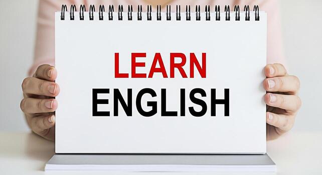 persona participación un cuaderno con el palabras aprender Inglés en un brillante bien iluminado estudio enfatizando el importancia de educación y idioma adquisición para personal y profesional crecimiento transporte un positivo foto