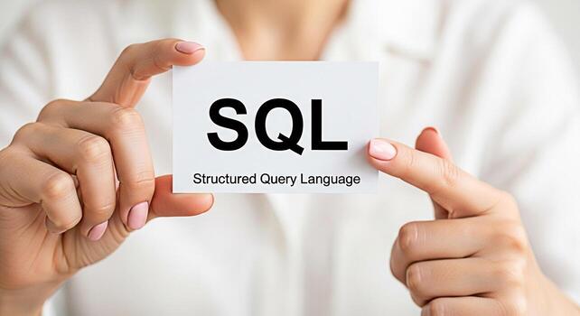 Closeup of a woman holding a card displaying SQL Structured Query Language in a bright neutral setting representing data management and database technology with a focus on clarity and professional com photo