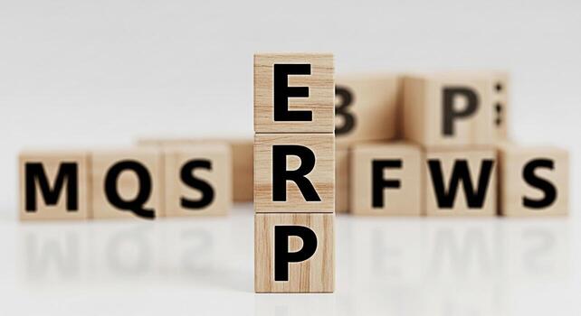Wooden blocks displaying ERP acronym in a bright studio environment representing enterprise resource planning and efficient business management solutions for streamlined operations and improved produc photo