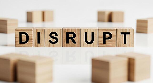 Wooden blocks spelling DISRUPT on a white surface surrounded by scattered blocks symbolizing innovation and change in a business environment creating a sense of urgency and forwardthinking strategy photo
