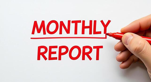 Hand underlining Monthly Report in bold red marker on a white background emphasizing financial analysis and business performance with a sense of urgency and importance for review and decisionmaking photo