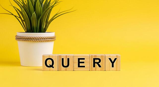 Wooden blocks spelling QUERY on a vibrant yellow background next to a potted plant representing information seeking and problemsolving in a bright and optimistic setting symbolizing curiosity and inve photo