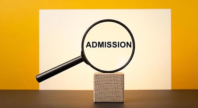 Magnifying glass focusing on the word Admission displayed on a white card set against a vibrant yellow background symbolizing scrutiny and the importance of the application process for educational ins photo