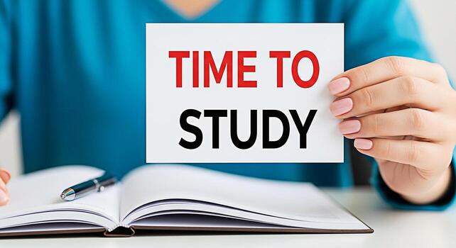 Closeup of a student holding a sign that says Time to Study over an open notebook with a pen on a white desk conveying a message of motivation and encouragement for academic success photo
