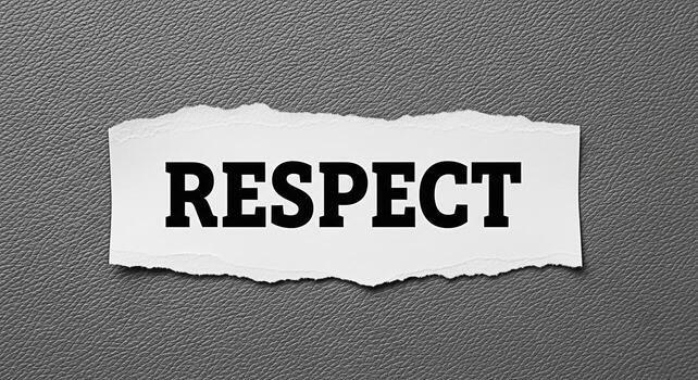 el palabra el respeto impreso en negrita negro letras en un Rasgado pedazo de blanco papel desplegado en contra un texturizado gris antecedentes simbolizando el importancia de mutuo consideración y ético comportamiento foto