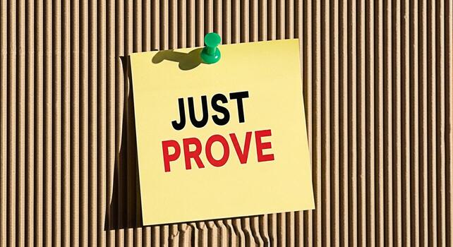 Motivational message Just Prove on a yellow sticky note pinned to a corrugated cardboard background symbolizing determination selfimprovement and the challenge to overcome obstacles with a positive mi photo