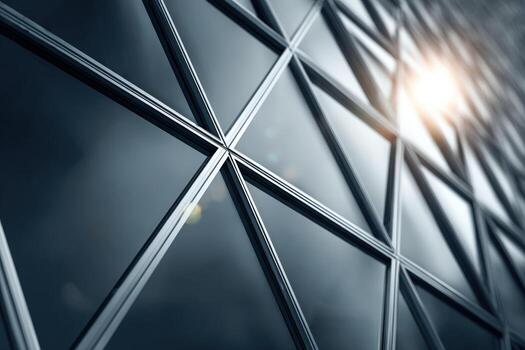 Geometric glass structure reflecting sunlight during the day photo