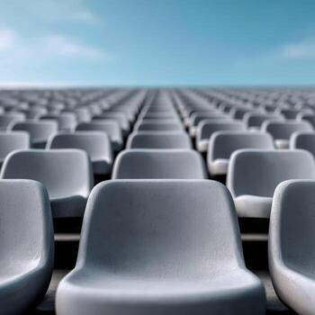 Empty stadium seats under a clear blue sky waiting for the event photo