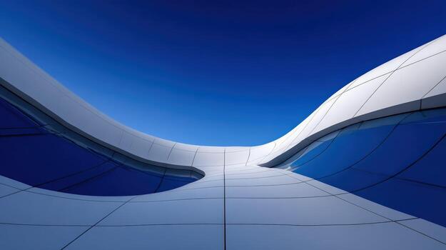 Modern architectural design with flowing lines against a clear sky photo