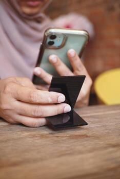 Person using smartphone to scan QR code for cafe menu photo