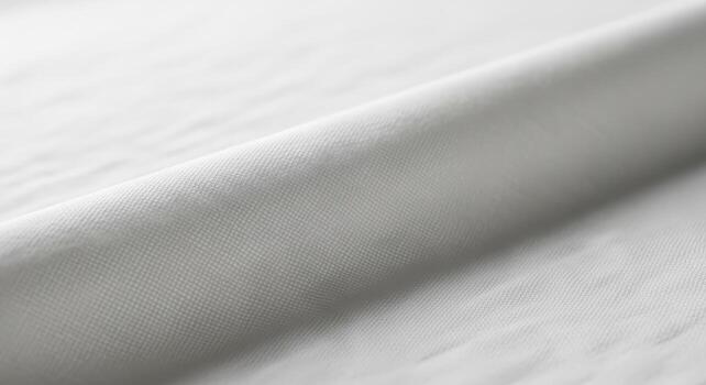 Delicate White Textile A Detailed View of Soft Cotton Muslin with Gentle Crease Lines and Subtle Shadowing. High-Key Lighting, No Text photo