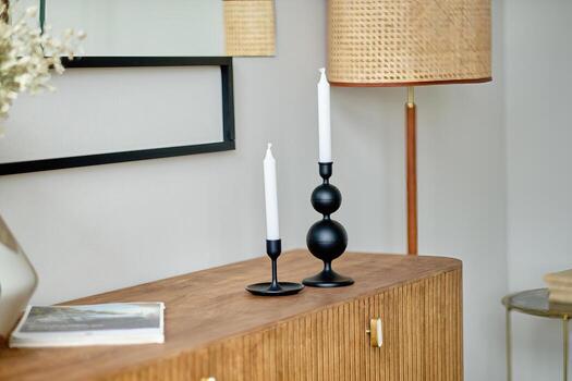 Candles in a beautiful candlestick as decorative elements photo
