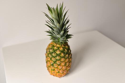 Pineapple on white table and background. Isolated. Summer concept. Flat lay, top view. photo
