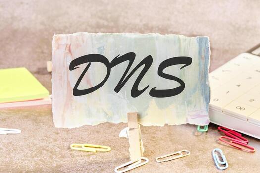 DNS -Domain Name Server text on a piece of paper on the table with a clothespin clamped photo
