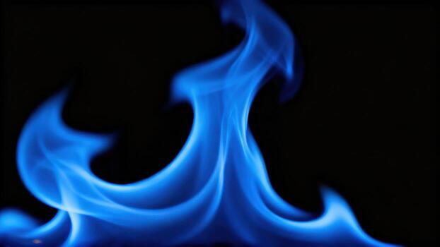 Blue flame on dark background photo