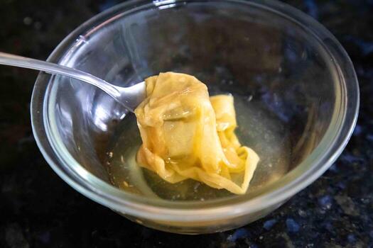 The mother of apple cider vinegar is a cloudy, gelatinous substance composed of bacteria and yeast that forms during the fermentation process. macro photo