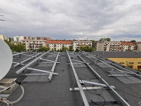 The structure on the roof for installing solar panels was built using a non-invasive method photo