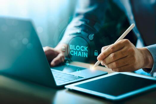 Blockchain technology innovation concept with business hand using digital pen on laptop and tablet, secure decentralized cryptocurrency system, fintech data security, bitcoin transaction, future photo