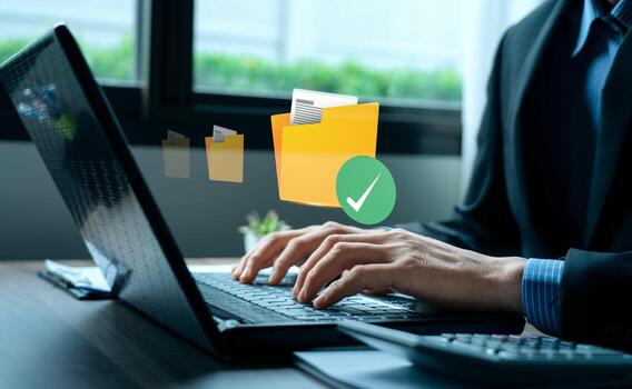 Businessman typing on laptop with virtual folder, green check mark, representing secure digital document management, approved file storage system, efficient data organization, workflow optimization photo
