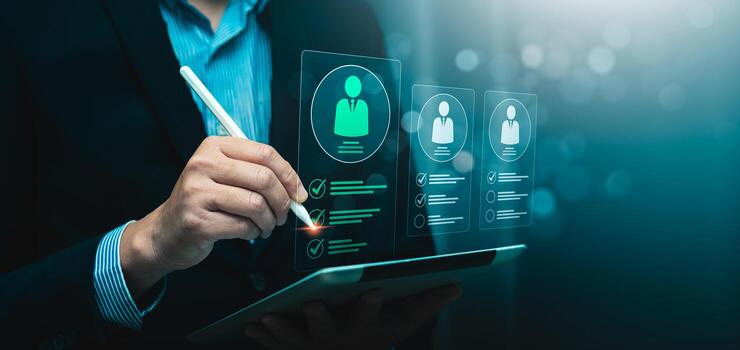 Digital recruitment and candidate selection concept with businessman using stylus to evaluate virtual resume profiles on tablet, symbolizing hiring process, HR technology, employee screening checklist photo