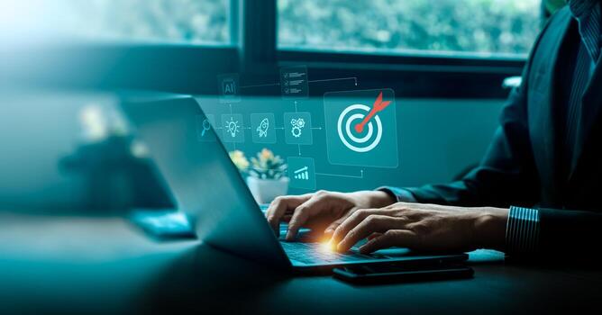 Businessman using laptop with virtual interface showing target icon and strategic planning process, symbolizing digital goal setting, project management, artificial intelligence, and business success photo