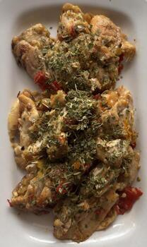 Smashed chicken on white plate upper view photo