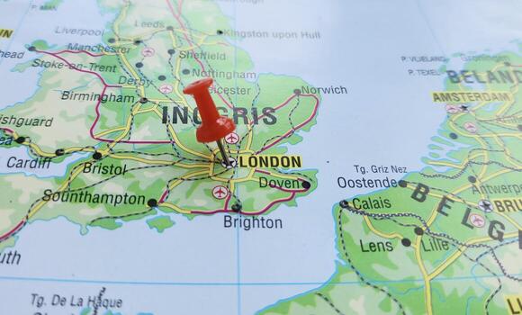 View of London, is the capital and largest city of both England and the United Kingdom, on a geographical map of Europa, marked with red pushpin photo