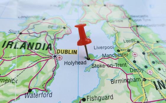 View of Holyhead, is a historic port town, and is the largest town and a community in the county of the Isle of Anglesey, Wales, UK, on a geographical map of Europa, marked with red pushpin photo