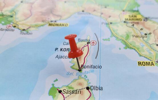 View of Bonifacio, is a commune in the southern tip of the island of Corsica, in the French department of Corse-du-Sud, on a geographical map of Europa, marked with red pushpin photo