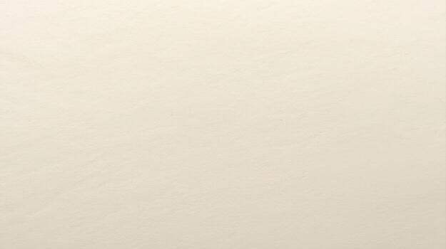 Delicate soft cream-colored fabric reveals subtle woven texture and gentle surface undulations in the light, creating a calming, neutral background. photo