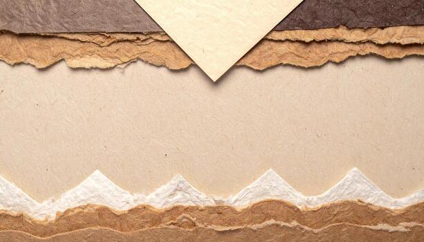 Earthy abstract design featu torn layered paper in neutral tones creating a textured background with organic shapes and a craft aesthetic. photo