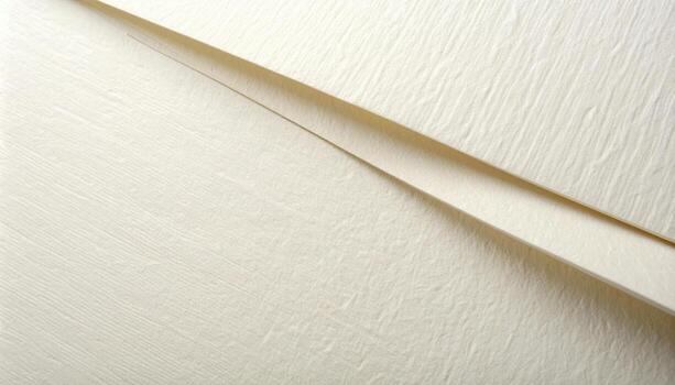 Close up of overlapping sheets of delicate textured paper create a subtle, geometric pattern emphasizing minimalist aesthetic quality and design. photo