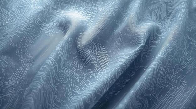 A softly draped fabric is printed with a pale blue circuit board pattern evoking a sense of technology innovation and modern design aesthetic. photo
