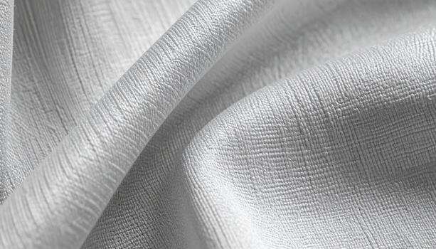 Close up shows the elegance of the white fabric with its subtle texture and delicate folds creating a soft and calming visual experience. photo