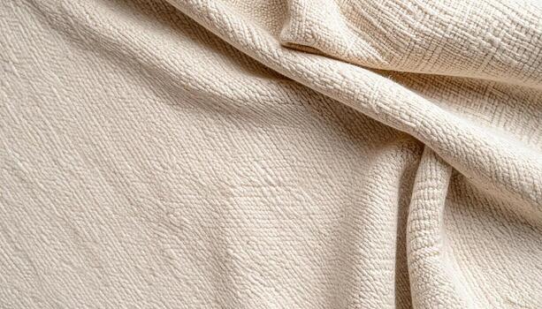A softly textured woven textile with delicate folds creates a visually appealing abstract background emphasizing gentle organic patterns and neutral photo