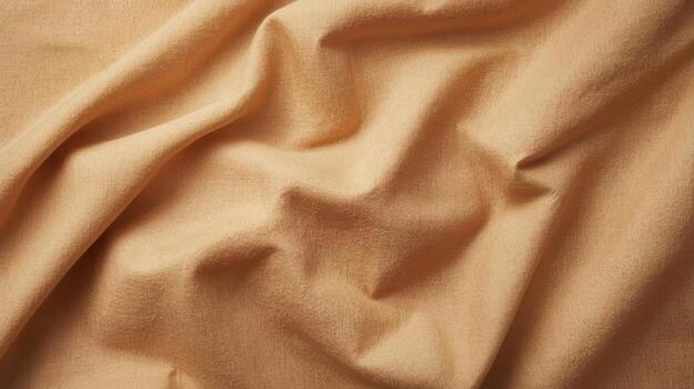 A close-up shot showcases the subtle folds and soft texture of a beige fabric, creating a warm and inviting neutral background element for design. photo