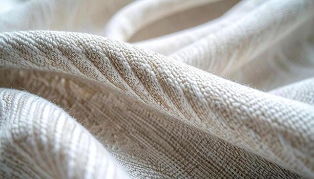 Close up of a textured beige fabric shows intricate woven patterns and subtle tonal variations creating a soft and organic surface design. photo