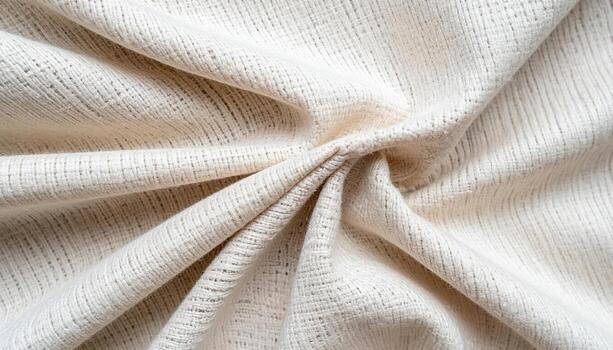 An intricately woven beige fabric elegantly drapes and gathers creating soft folds highlighting the textile's texture and subtle pattern detail. photo