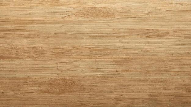 The smooth surface of the light brown wooden plank shows its subtle grain and natural textures, creating a warm, organic background element. photo
