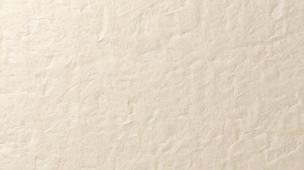 Cream colored paper background shows a rough surface with crumpled texture, with slight shadows creating depth and visual interest. photo