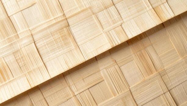 An abstract close up captures a light wooden woven mat with a natural beige color that could be used as a background texture or pattern. photo