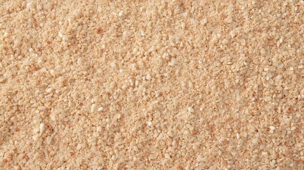 Close up shot showcases a granular texture of light brown sesame seeds used as a versatile ingredient in various culinary applications now. photo