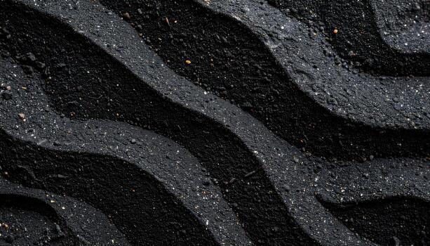 Dark wavy lines of rough asphalt create an abstract textured background with an undulating pattern of black and gray shades in full frame shot. photo