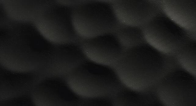 Dark textured surface with a subtle wavy pattern creates an abstract and elegant background for graphic design projects and presentations. photo