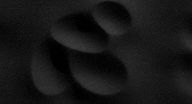 Abstract dark background showcases blurred spheres of different sizes creating a modern and minimalist yet elegant sophisticated design aesthetic. photo