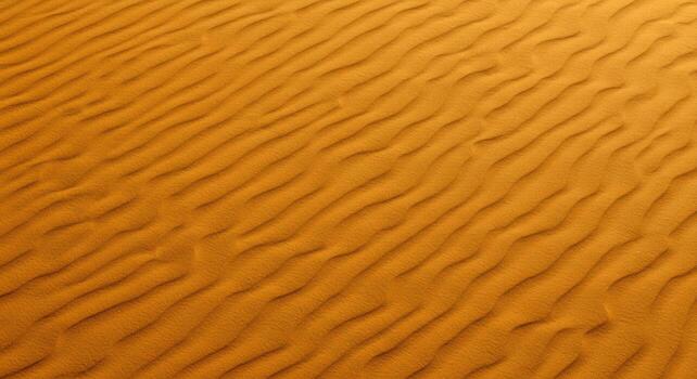Golden sand dunes exhibit mesmerizing wave patterns across the arid desert landscape in an abstract and textured natural formation. photo