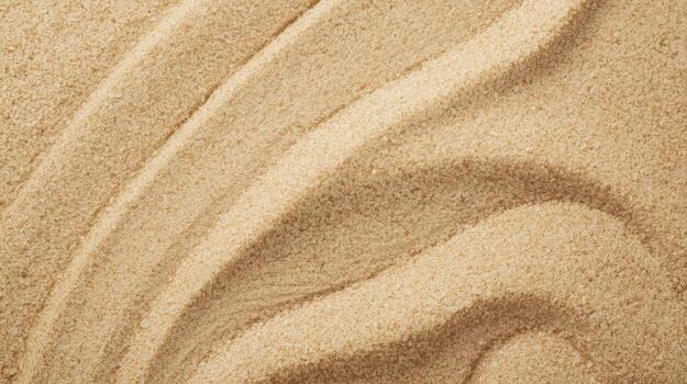 The rippled patterns in the sand are captured in a top down view creating a beautiful abstract texture perfect for backgrounds or design. photo