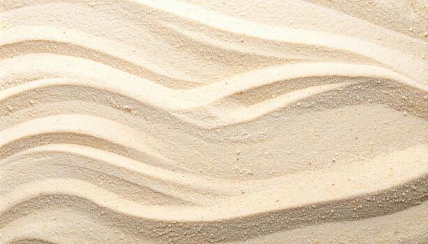 The delicate, wave-like patterns etched into the pristine white sand create a soothing and natural textured surface for a beach backdrop. photo
