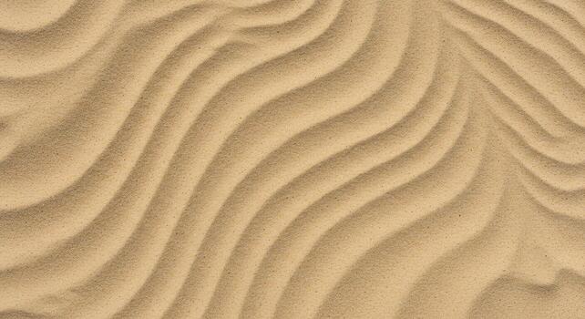 Close up of wavy sand patterns on a beach creates a stunning abstract image evoking tranquility and the rhythmic power of nature itself. photo