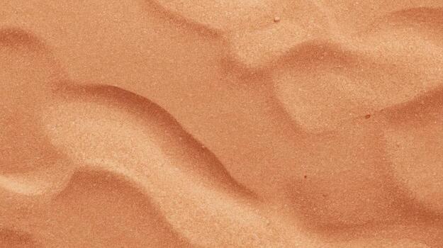calentar dorado Desierto arena dunas crear resumen ondulado texturas con ondulado patrones brillante en el brillante luz de sol en un soleado día paisaje. foto